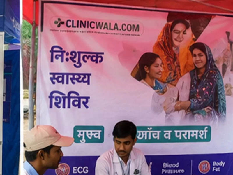 Camp staff at a ClinicWala desk registering visitors indoors
