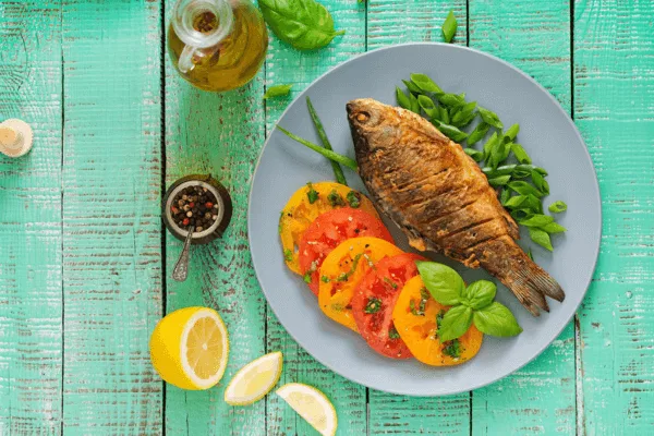 Grilled fish with sauteed vegetables